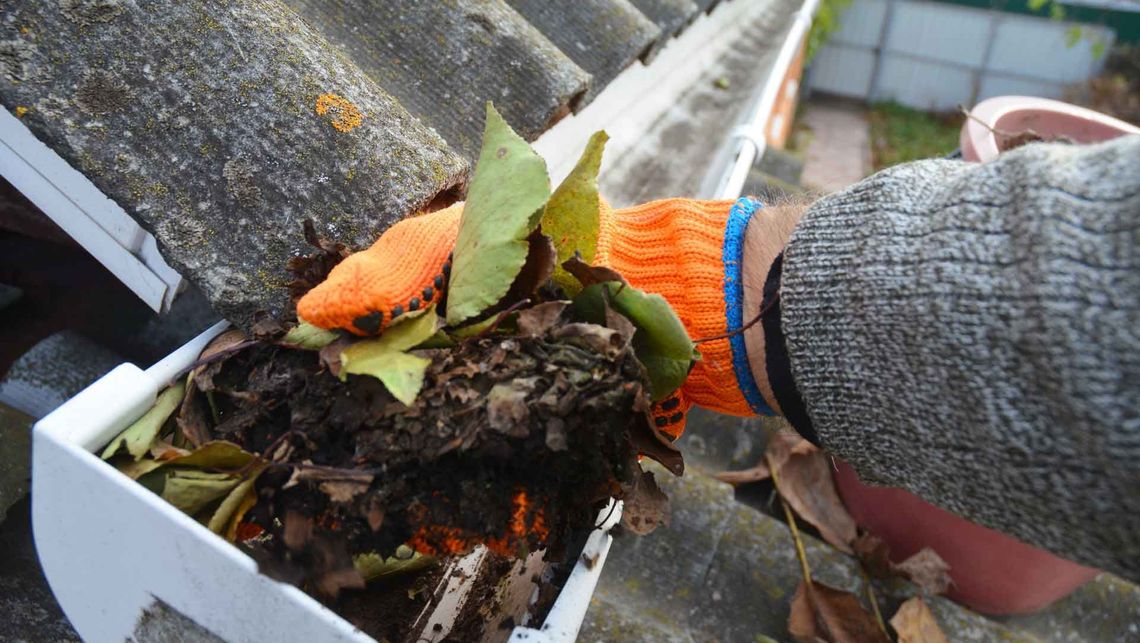 Removing built-up dirt and debris from a gutter